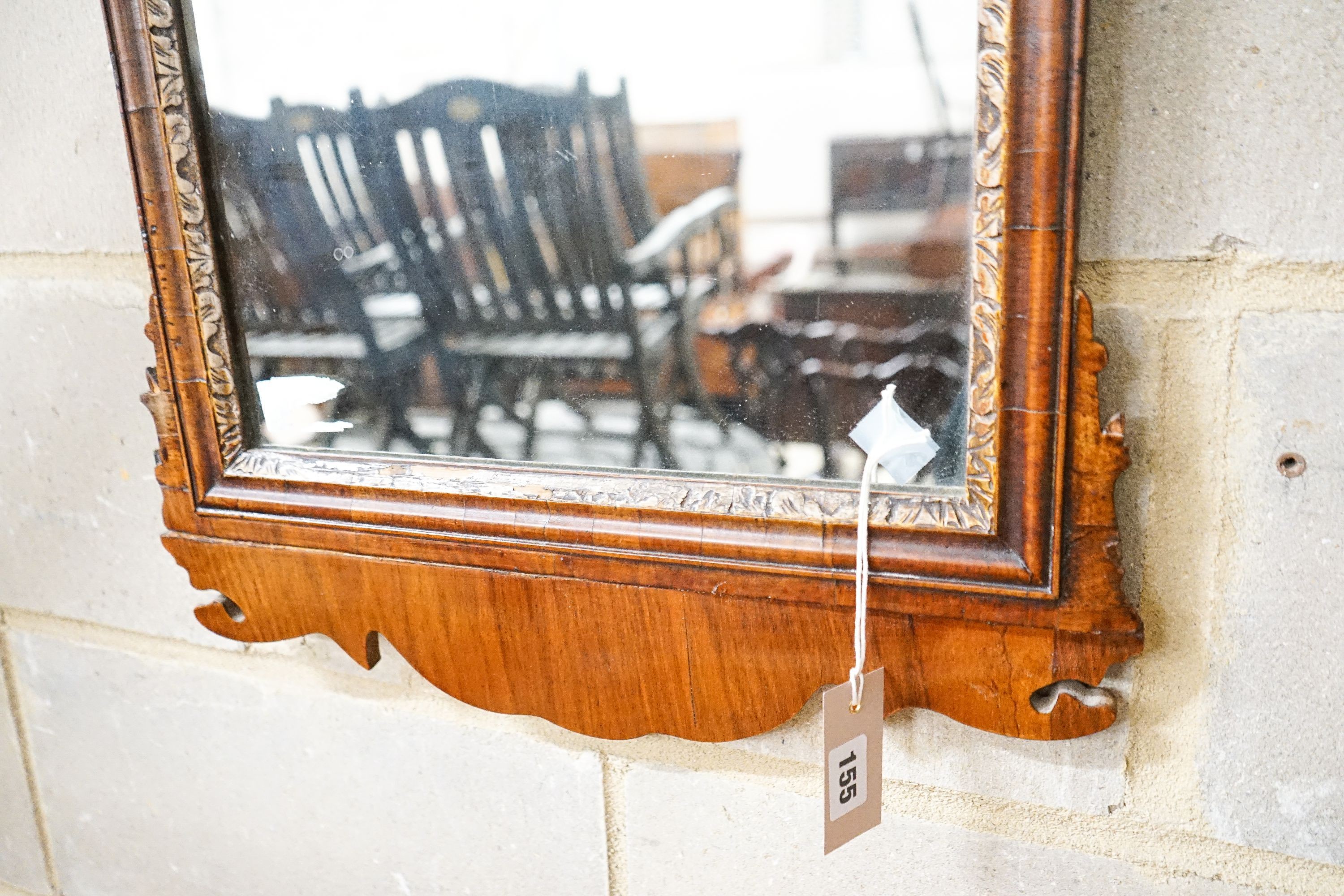 A George II walnut and parcel gilt fret cut wall mirror, width 46cm, height 88cm